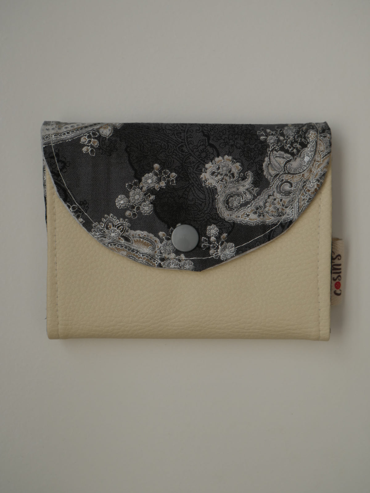 Cartera de tela · Crema i paisley gris